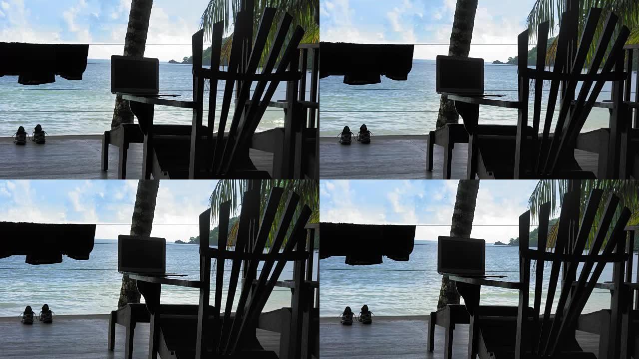 特立尼达和多巴哥旅游胜地阿迪朗达克椅子上的笔记本电脑