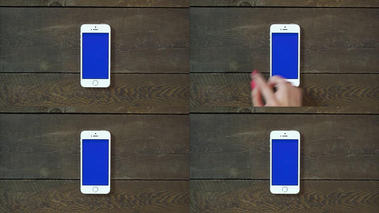 滑动带有蓝屏的左手智能手机