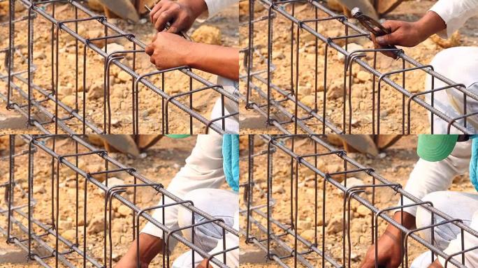 工人弯曲和捆扎用于建筑工作的钢