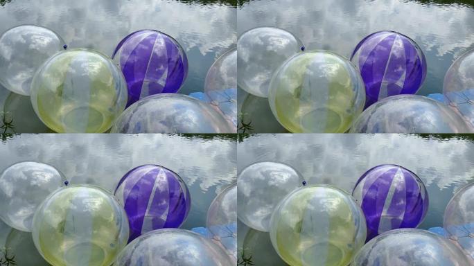 池塘中的充气透明球-冒险活动
