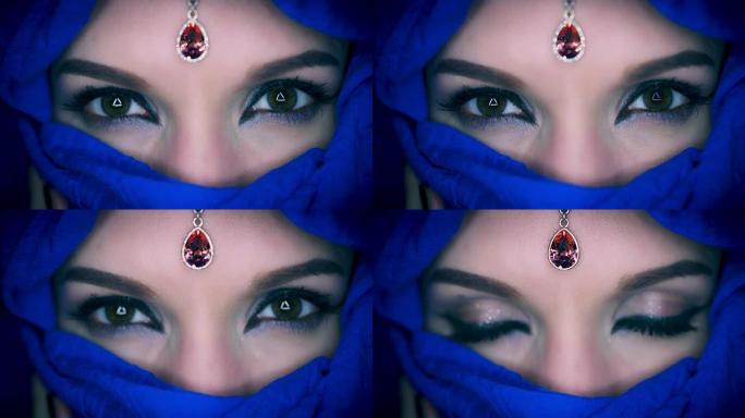 4k彩色阿拉伯女人的眼睛与面纱特写，焦点改变宝石