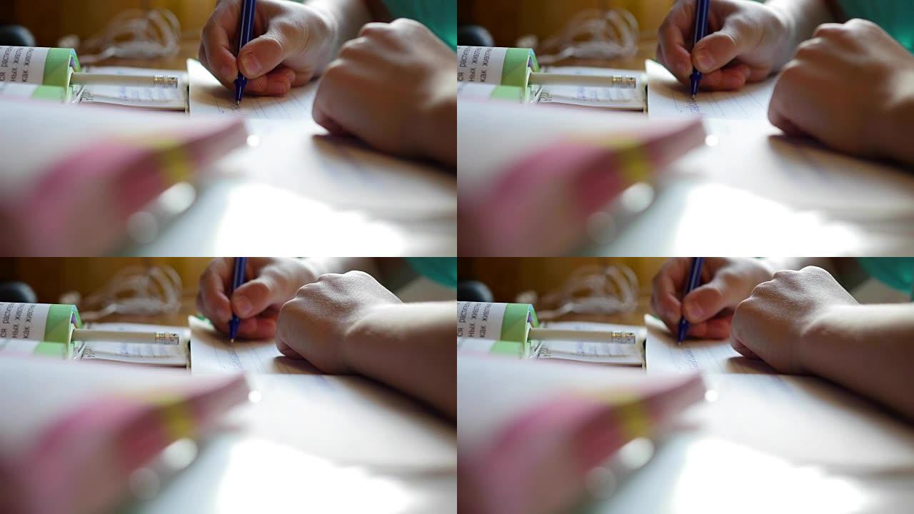 孩子做作业，在桌子特写的抄写书中写