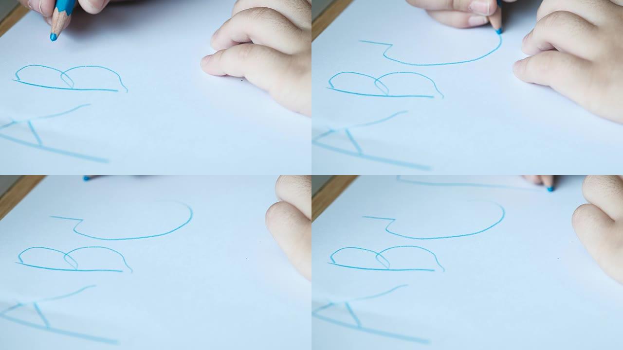 孩子的手写一个b c字母。