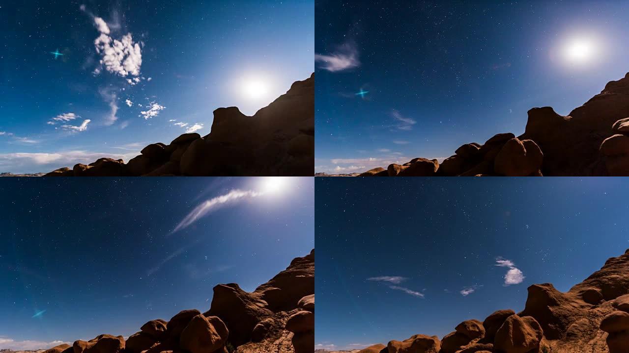 犹他州哥布林谷州立公园的夜空与满月升起或月升的延时镜头，显示了荒野自然中的云，星星和峡谷轮廓
