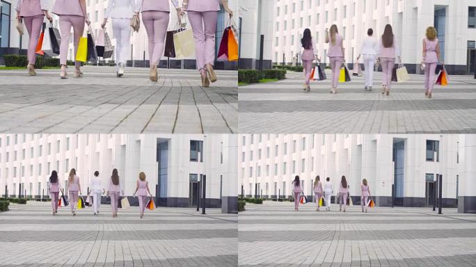 五位迷人的商业女性在城市中行走