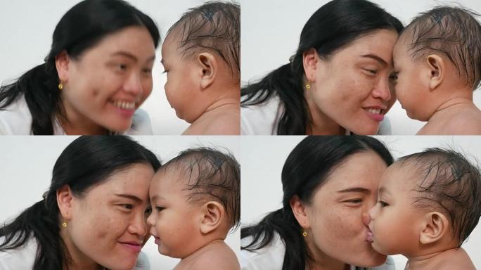 亚洲婴儿与母亲接吻