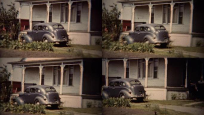 1962: 经典的灰色道奇汽车停在郊区的房子车道。