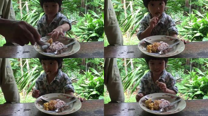 吃午餐的亚洲小男孩