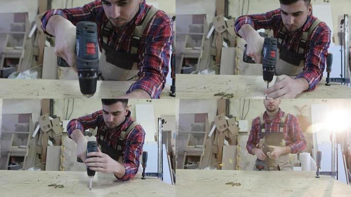 4k一位年轻的木匠在家具生产中用螺丝刀转动自攻螺钉。