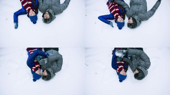 躺在雪地里的年轻夫妇
