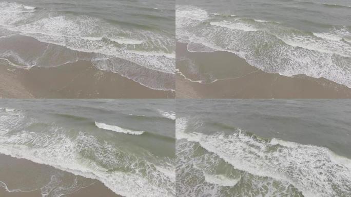 海浪撞击海滩的鸟瞰图