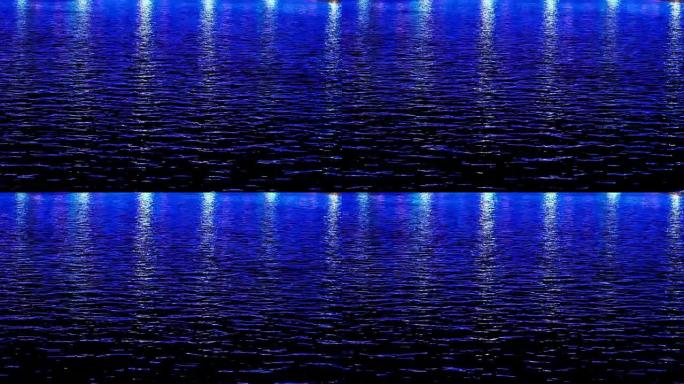 夜间水中城市倒影的蓝光