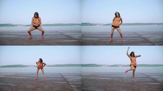在FullHD的海滩上跳舞嘻哈的迷人女孩