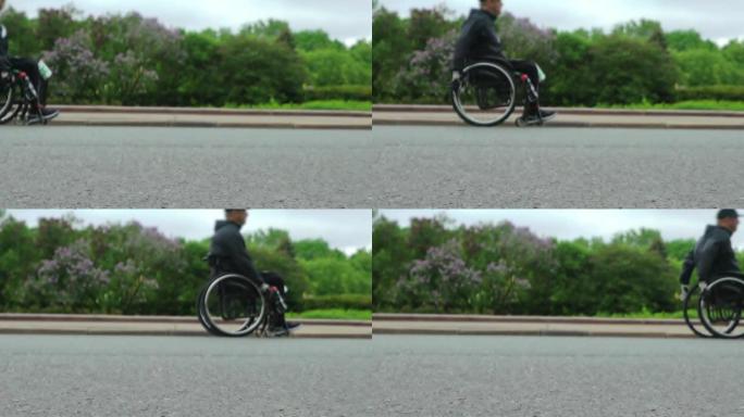 意志力和强手的概念。残疾人运动员在比赛中坐在运动轮椅上。慢动作。循环