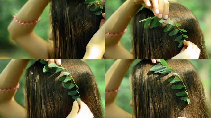 年轻的黑发女人在森林的头发中插入叶子