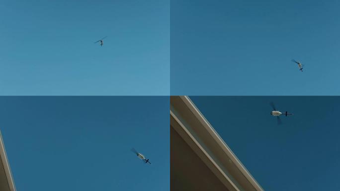 直升机在蓝天中飞行，在户外拍摄摄制组飞行