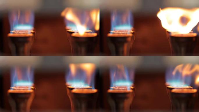 燃烧器燃气灶特写。气体用蓝色火焰燃烧。
