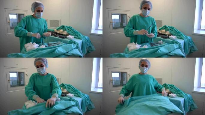 外科医生戴着蓝色手套，在手术前准备器械。擦拭手术夹。