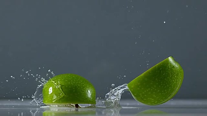 奶奶史密斯苹果，苹果苹果，黑色背景下落在水上的水果，慢动作4K
