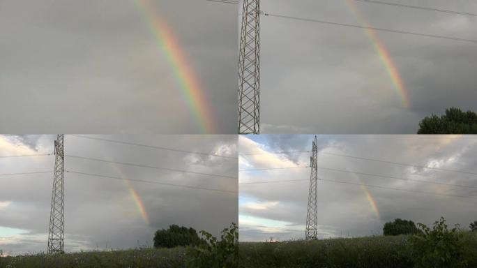 高压电杆附近多云天空中的彩虹色