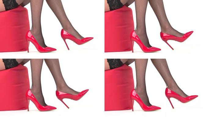 穿着红色鞋子的女性腿。