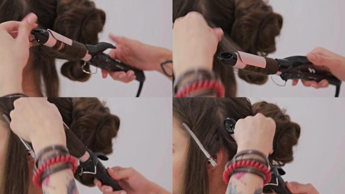 特写镜头。理发师为年轻漂亮女人做发型 -- 卷发