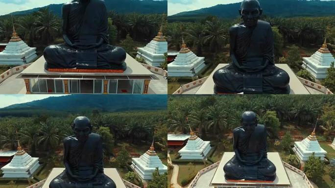 天线: 泰国寺的大和尚雕像。