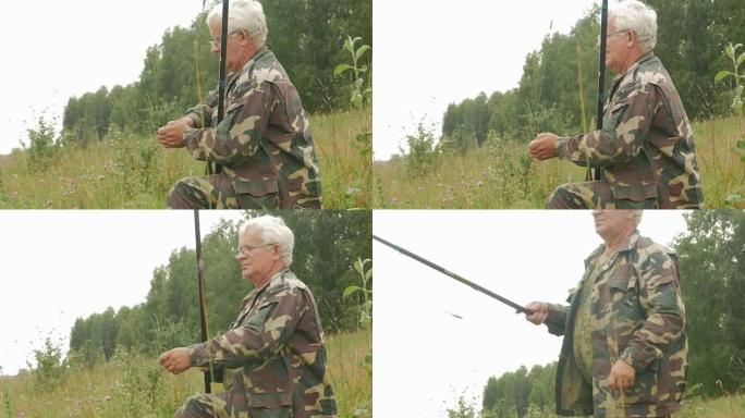 夏天，一位老人在一条小河上钓鱼。使用鱼竿和蠕虫。森林和绿草