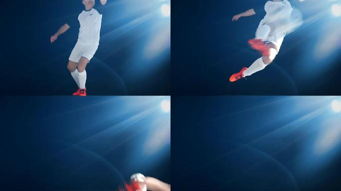 足球运动员跳跃和踢球