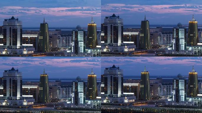 哈萨克斯坦阿斯塔纳市中心和中央商务区的高架夜景，带黄色塔楼