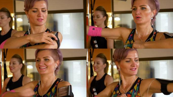 成年女性使用健身追踪器并在健身房锻炼的特写镜头