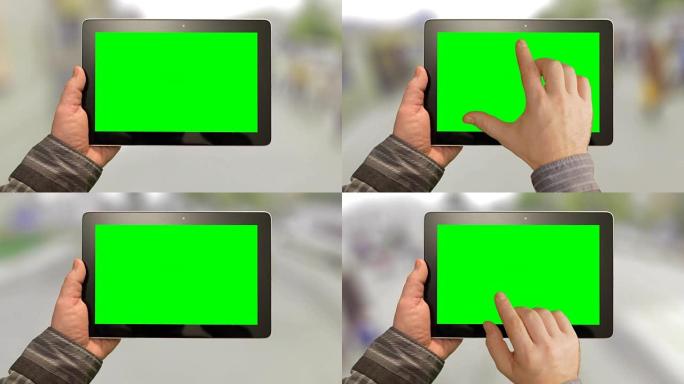 与平板电脑一起行走，绿色背景上的绿色屏幕