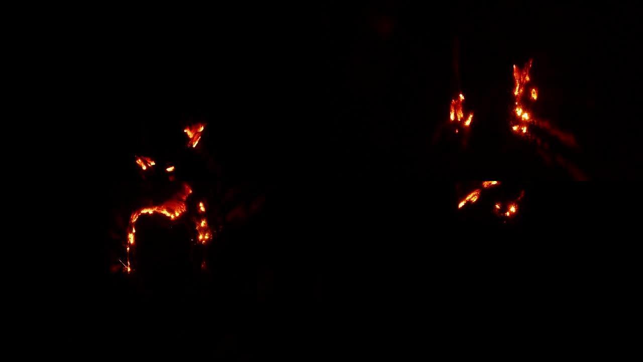 在黑暗中抽象的钢棉燃烧小火焰路径