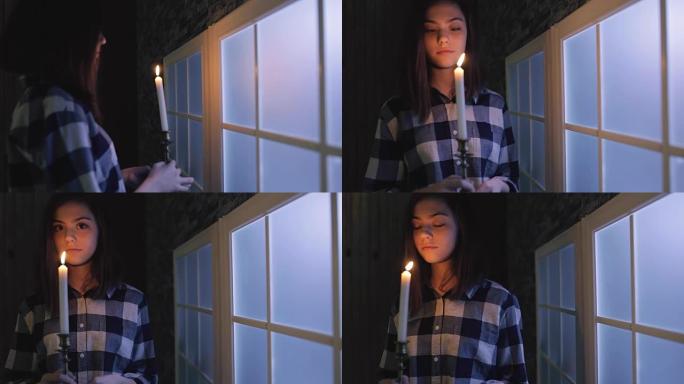 万圣节之夜，十几岁的女孩拿着蜡烛