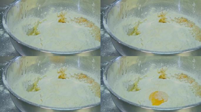 蛋黄落入面粉碗中