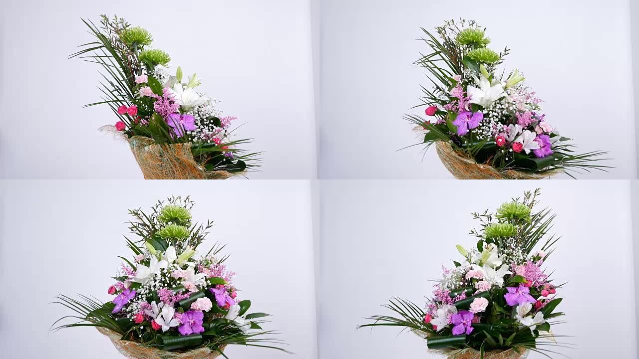 鲜花，花束，白色背景上的旋转，花卉组成由凤凰罗比贝利，桉树，菊花，玫瑰莉迪亚，康乃馨，满天星，一枝黄