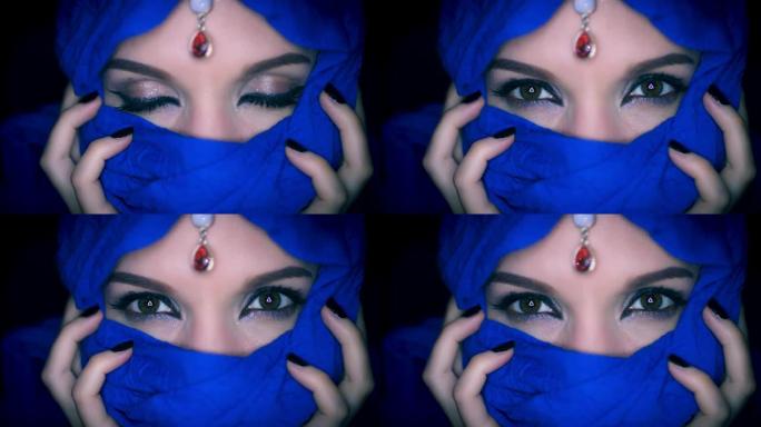 4k彩色阿拉伯女人睁开眼睛的面纱和珠宝特写