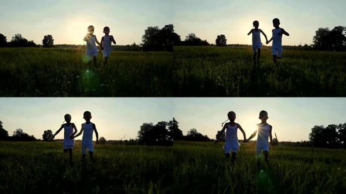 夏天日落时，在太阳的背景下，孩子们，男孩和女孩的身影正在奔跑，玩得开心。幸福的家庭。慢动作