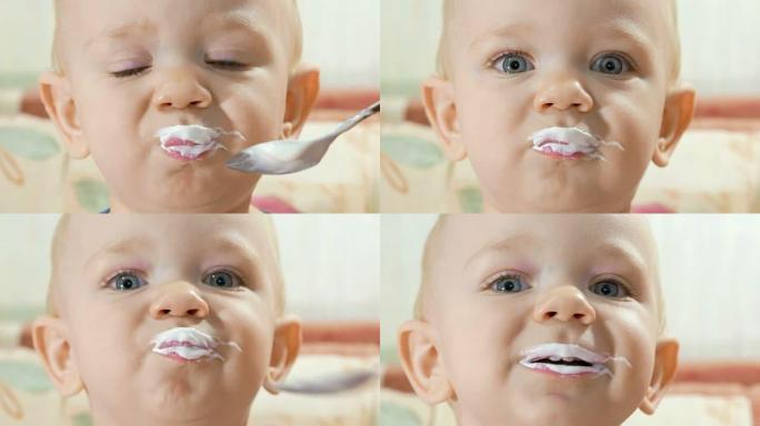 迷人的婴儿用母亲用勺子吃奶酪。孩子1年。特写