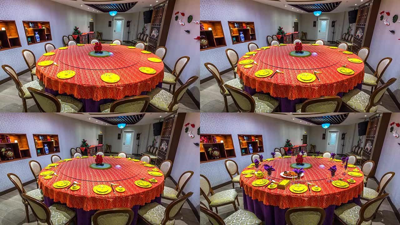 圆桌上的红色餐具和黄色盘子和杯子延时定格动画。中式晚餐餐具套装