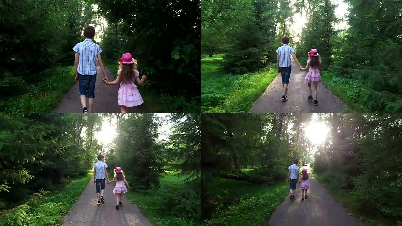 十几岁的男孩和女孩正在公园的轨道上。兄妹俩手牵着手。