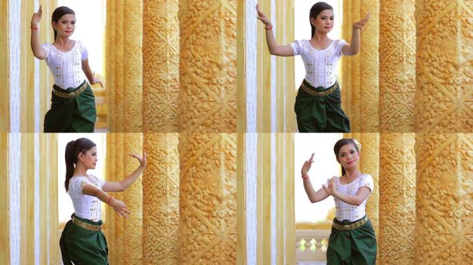 美丽的亚洲女孩在寺庙里表演柬埔寨民间舞蹈
