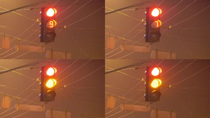 夜间带定时器的红绿灯特写从红色到绿色