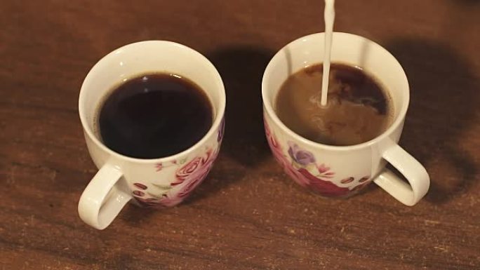 女孩把牛奶倒进两杯咖啡里。