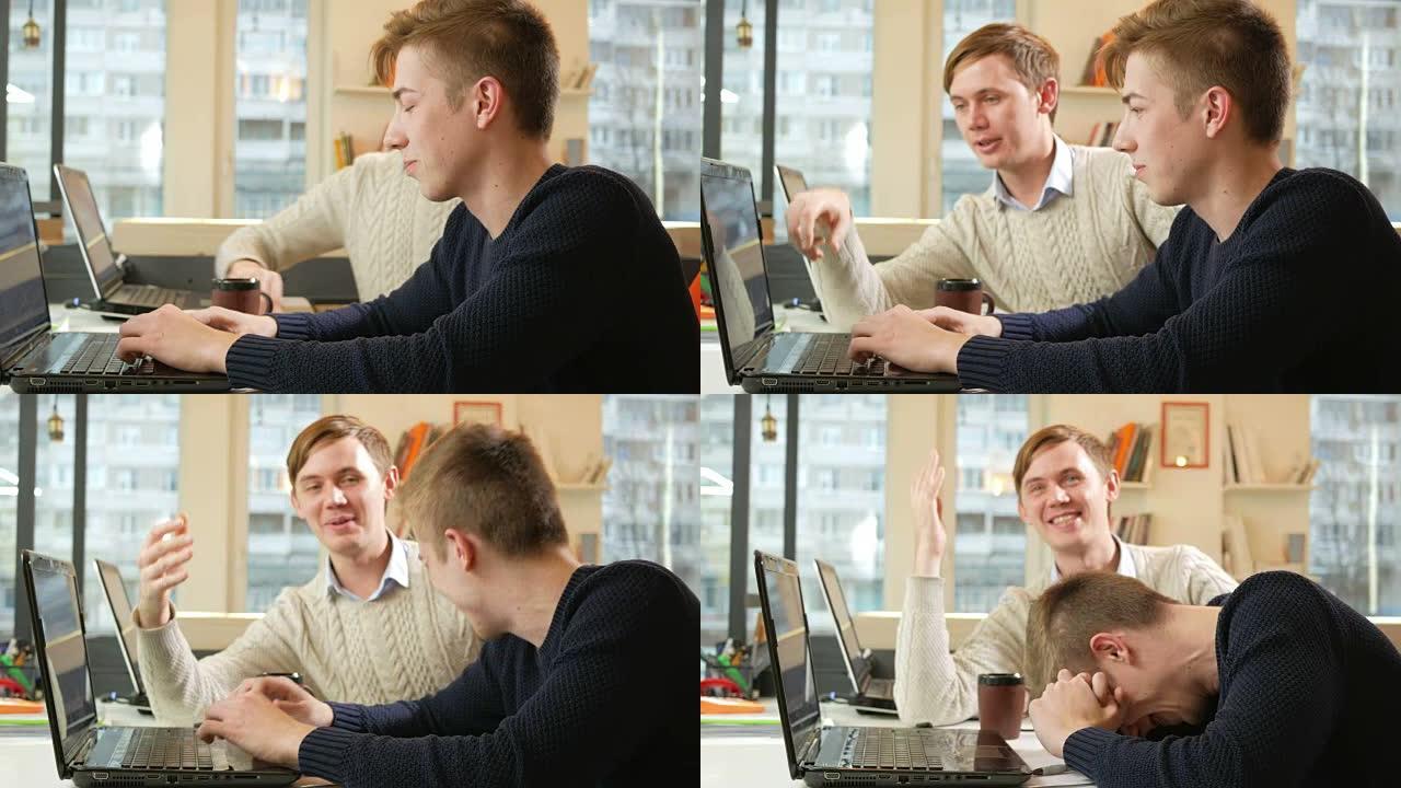 年轻人在笔记本电脑的办公室里工作，因为乏力而开始大笑
