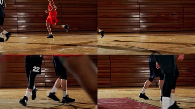 篮球运动员在球场上奔跑的低角度