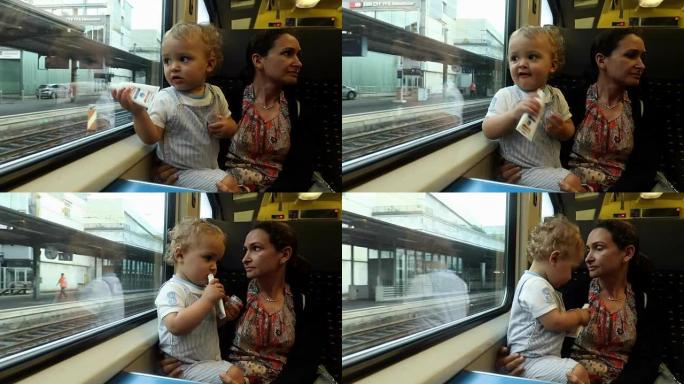 妈妈和宝宝一起在火车上行驶