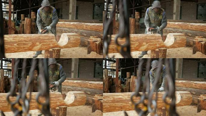 男人为未来的家切割木锯。建筑工人脸上的防护面罩和大量木屑。机库，背景是未来家园的一部分