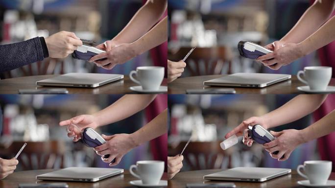 在咖啡馆使用信用卡终端。特写，男性双手用信用卡。无联系方式付款
