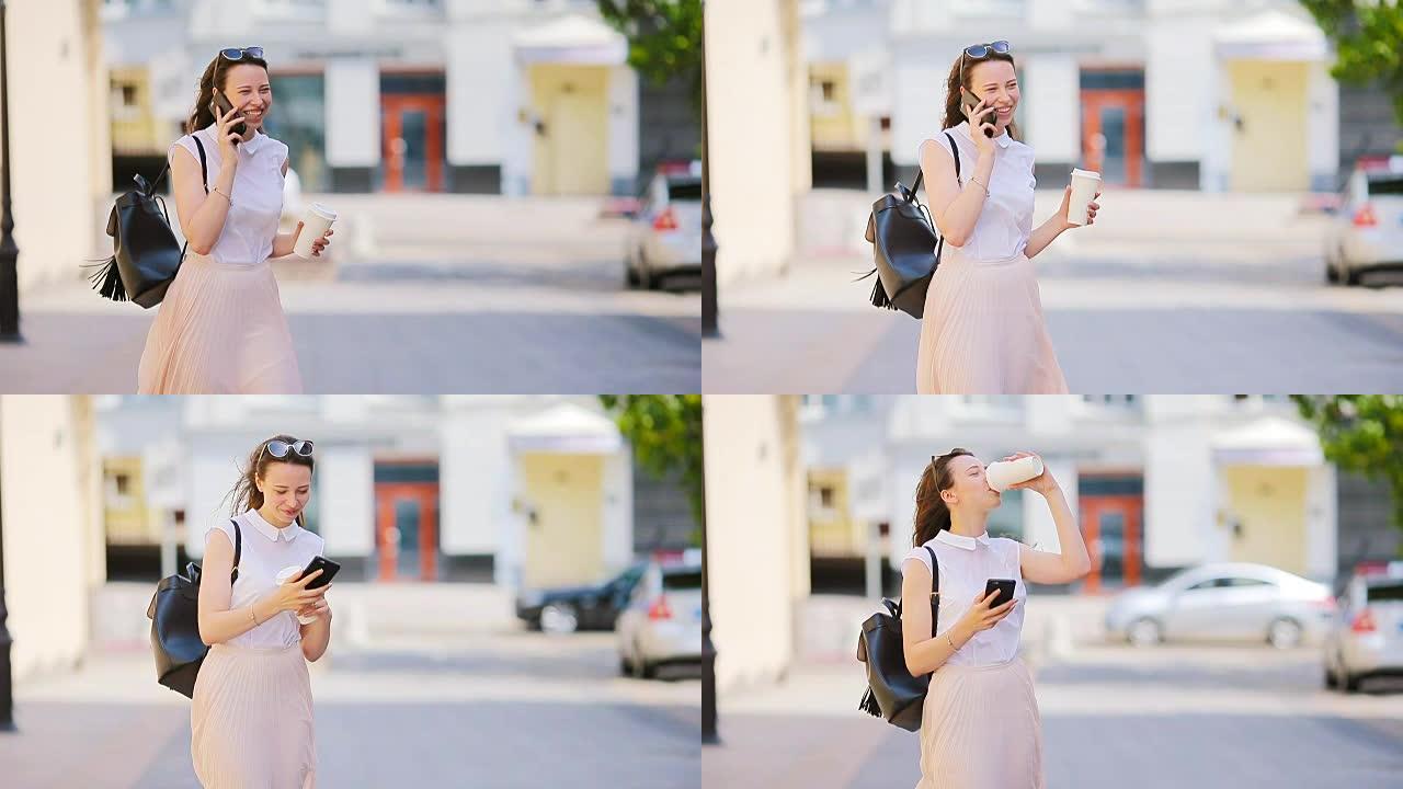 年轻的高加索女孩在欧洲城市的户外智能手机上聊天。穿着墨镜的漂亮女孩在街上使用智能手机，并与朋友通过电